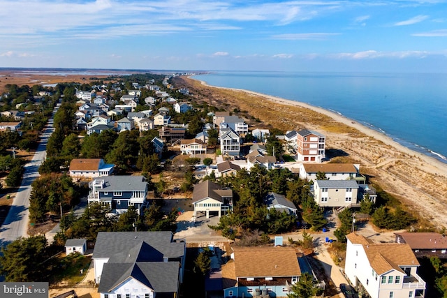 drone / aerial view with a water view and a view of the beach