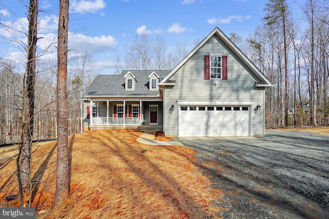 view of front property featuring a garage and a porch