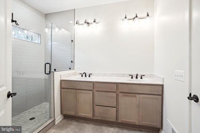 bathroom with vanity and an enclosed shower