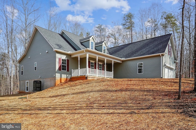 view of front facade featuring a porch and a garage