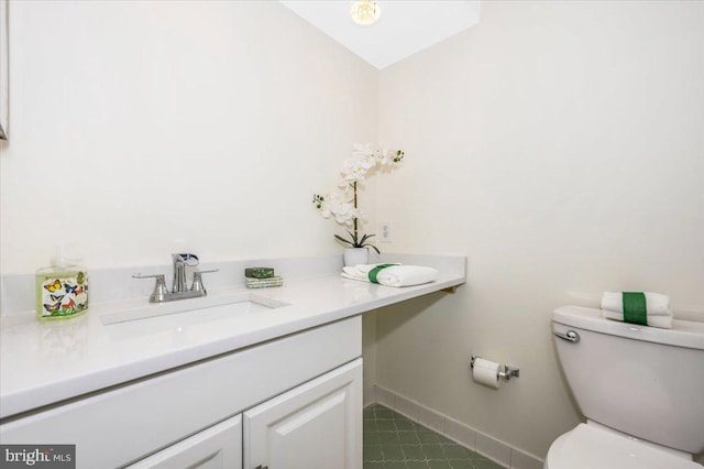 bathroom with vanity and toilet