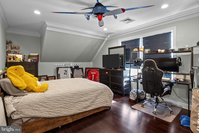 bedroom featuring dark wood-type flooring, ceiling fan, and crown molding