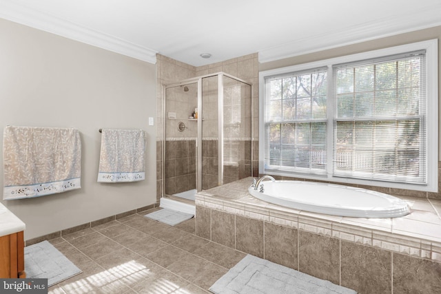 bathroom with ornamental molding, tile patterned floors, and independent shower and bath