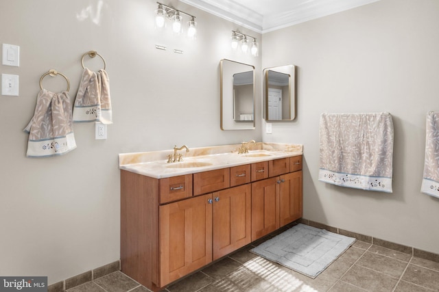 bathroom featuring vanity, tile patterned flooring, and crown molding