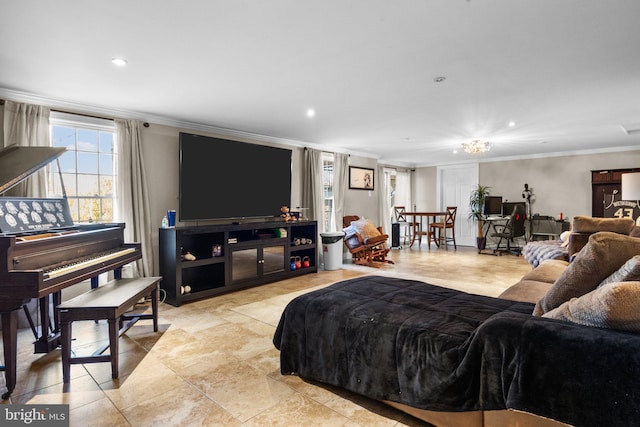 living room with ornamental molding, a chandelier, and light tile patterned floors