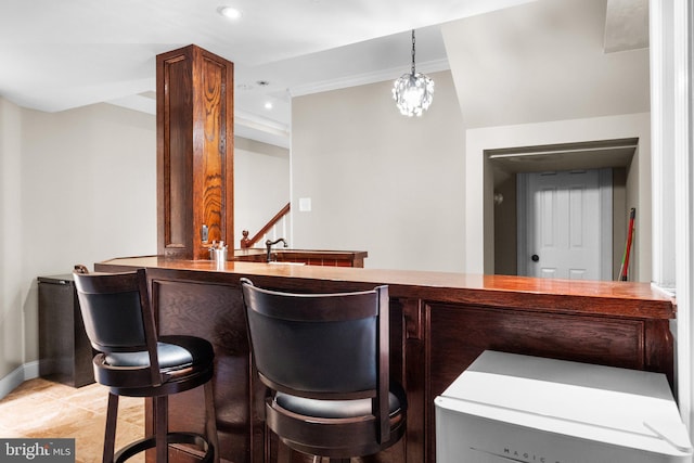 bar with light tile patterned flooring, an inviting chandelier, decorative light fixtures, and crown molding