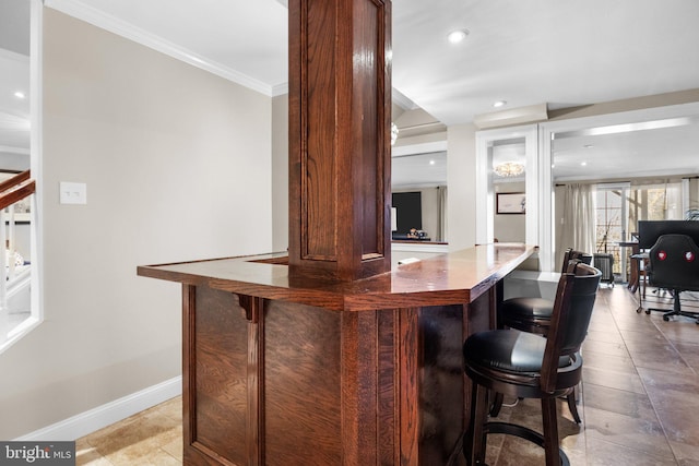 bar featuring crown molding