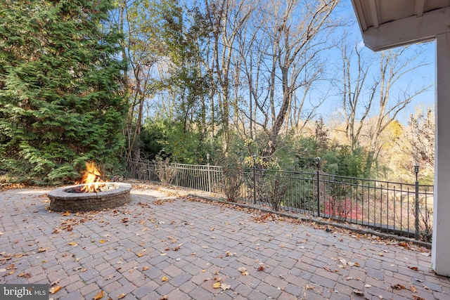 view of patio with a fire pit