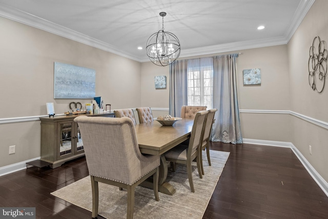 dining space featuring dark hardwood / wood-style flooring, a chandelier, and crown molding