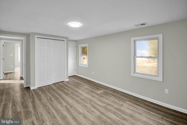 unfurnished bedroom featuring wood-type flooring