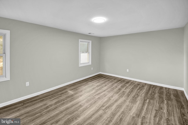 empty room featuring dark hardwood / wood-style floors