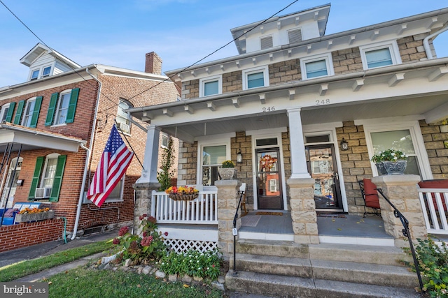 multi unit property featuring cooling unit and covered porch