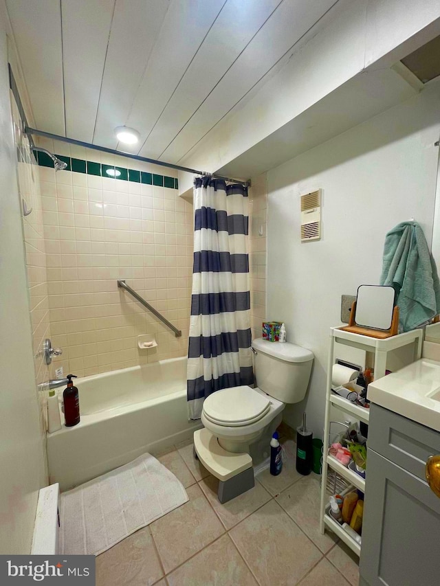 full bathroom featuring vanity, shower / tub combo with curtain, tile patterned floors, and toilet