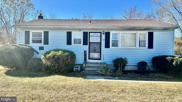 view of front of home with a front yard