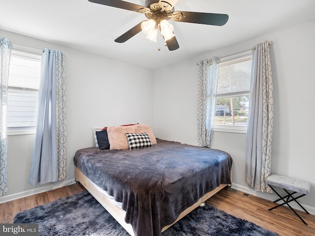 bedroom featuring wood-type flooring and ceiling fan