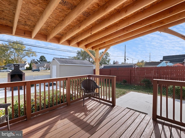 wooden deck with a shed