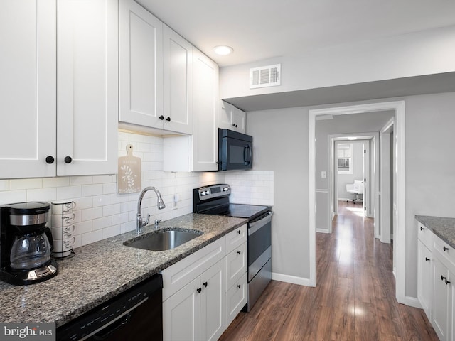 kitchen with white cabinetry, black appliances, sink, and dark stone counters