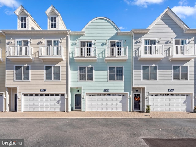 37601 Atlantic St Unit 8, Rehoboth Beach, DE 19971 - view of front facade with an attached garage and driveway