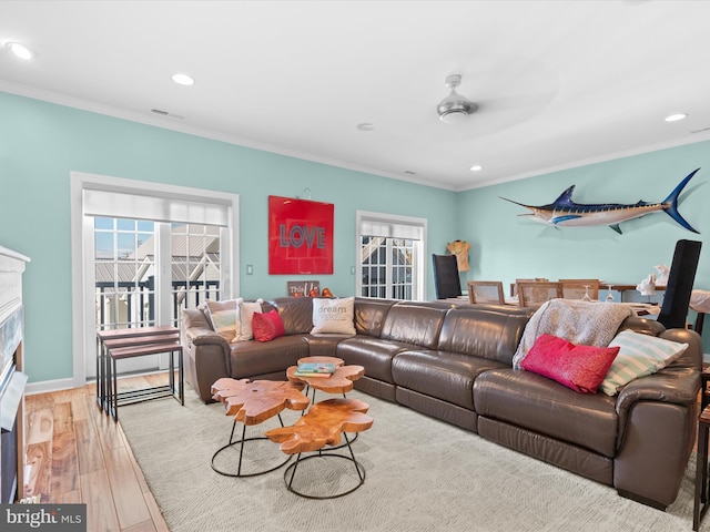 37601 Atlantic St Unit 8, Rehoboth Beach, DE 19971 - living area with crown molding, wood finished floors, recessed lighting, a fireplace, and a ceiling fan