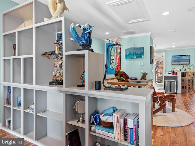 room details with hardwood / wood-style floors and ornamental molding