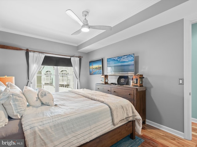 bedroom with ceiling fan, access to exterior, light wood-type flooring, and ornamental molding