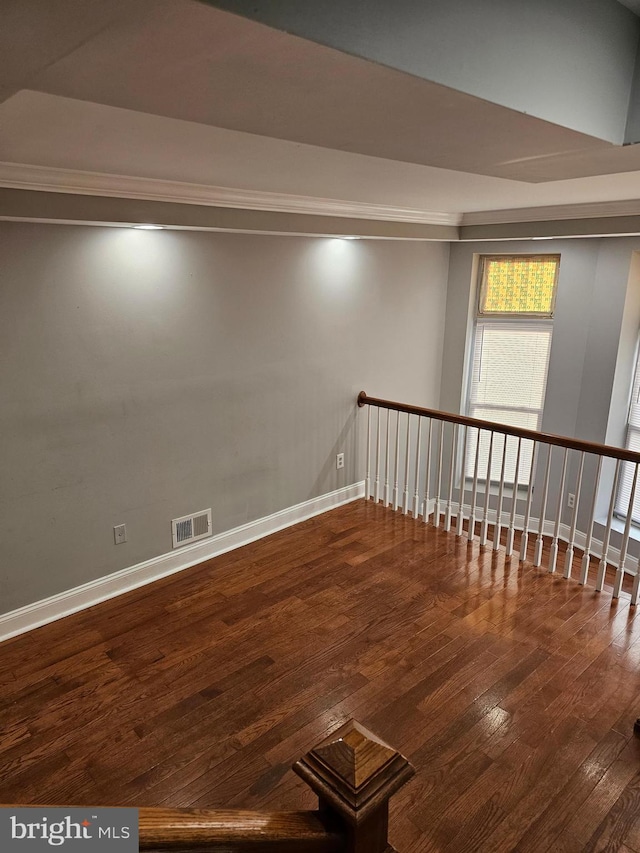 unfurnished room with dark hardwood / wood-style flooring