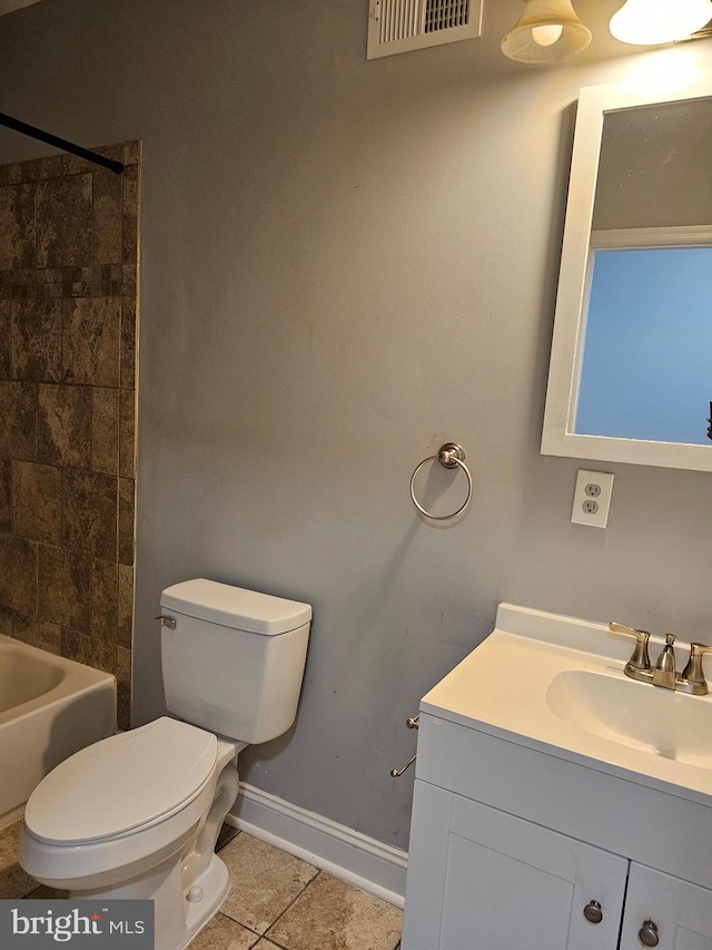 full bathroom featuring tile patterned flooring, vanity, toilet, and tiled shower / bath