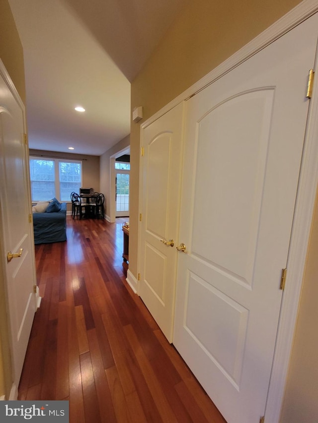 hall with dark wood-type flooring