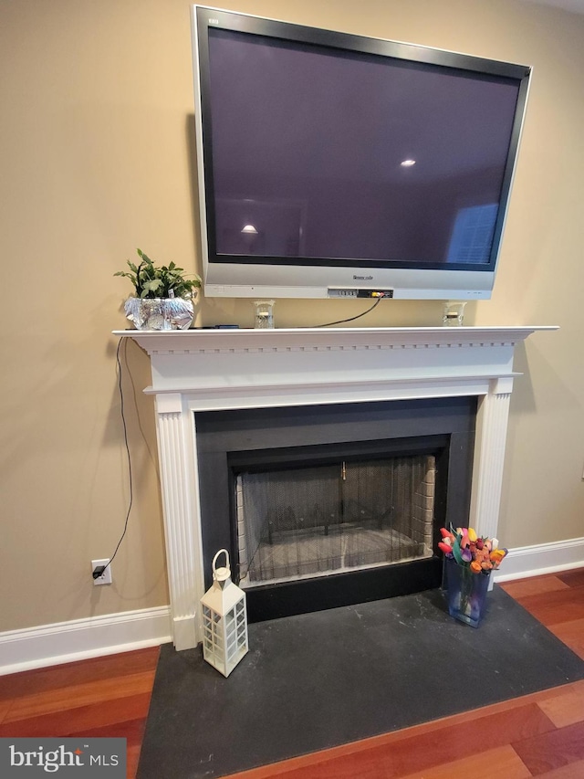 interior details featuring hardwood / wood-style floors