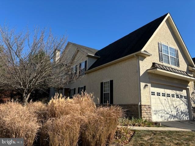 view of home's exterior with a garage