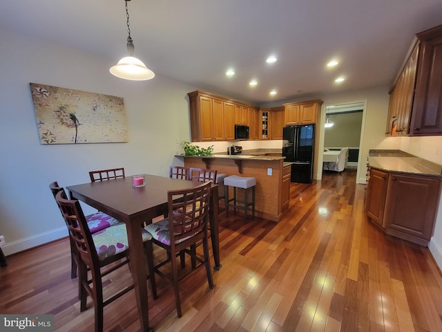 dining room with dark wood-type flooring