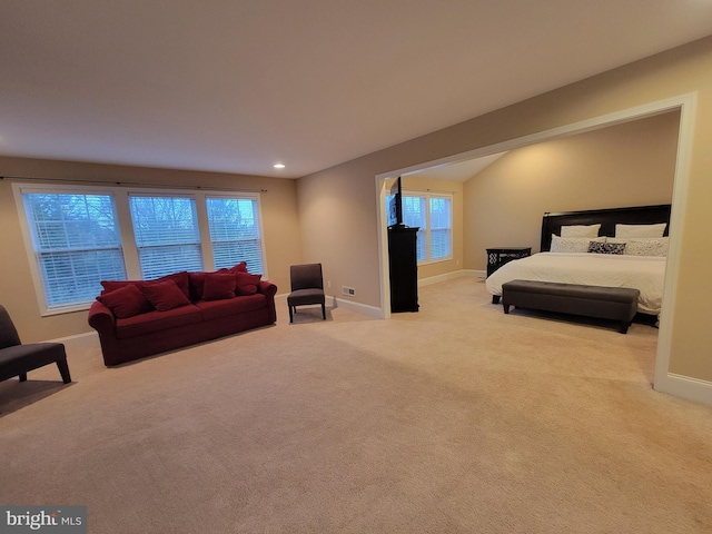 bedroom featuring light carpet