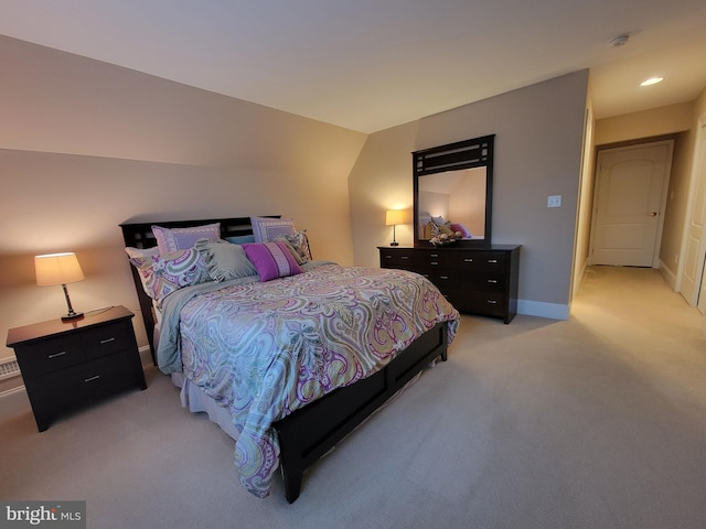 bedroom featuring light colored carpet