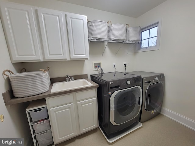 washroom featuring sink, light colored carpet, cabinets, and independent washer and dryer