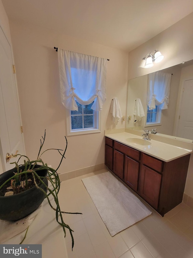 bathroom featuring tile patterned flooring and vanity