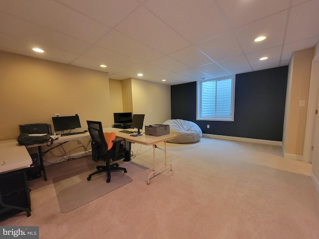 office area with carpet flooring and a drop ceiling