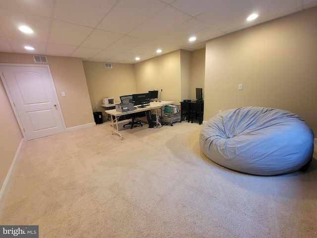 office space featuring carpet flooring and a paneled ceiling