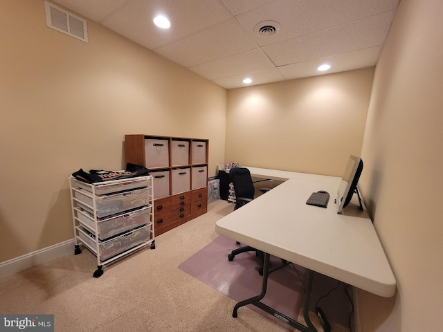 carpeted office featuring a paneled ceiling