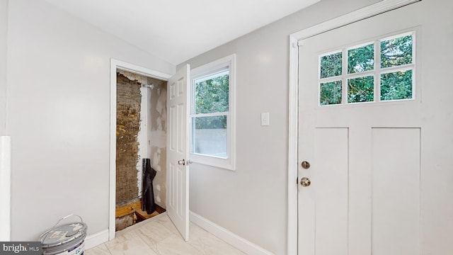 entryway with vaulted ceiling