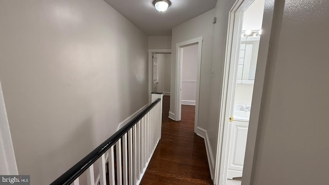 hallway featuring dark hardwood / wood-style floors