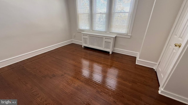 interior space featuring dark hardwood / wood-style floors and radiator