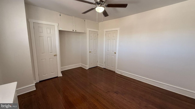 unfurnished bedroom with dark hardwood / wood-style floors and ceiling fan