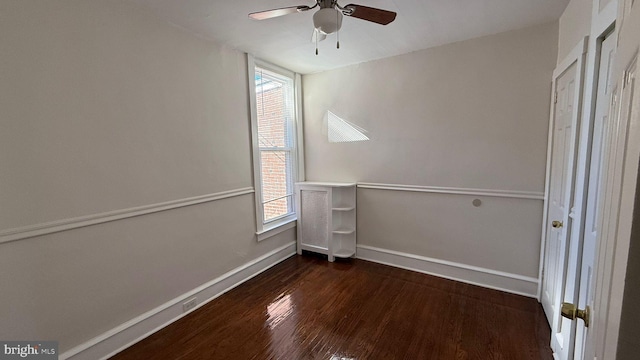 interior space featuring ceiling fan, dark hardwood / wood-style floors, and plenty of natural light