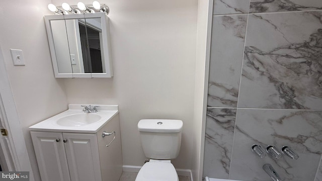 bathroom with toilet and vanity