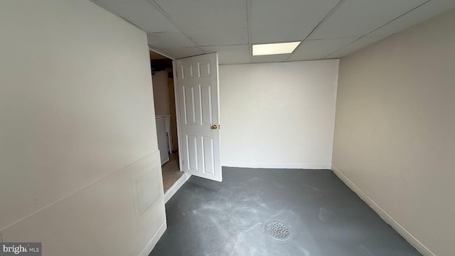 spare room featuring a paneled ceiling