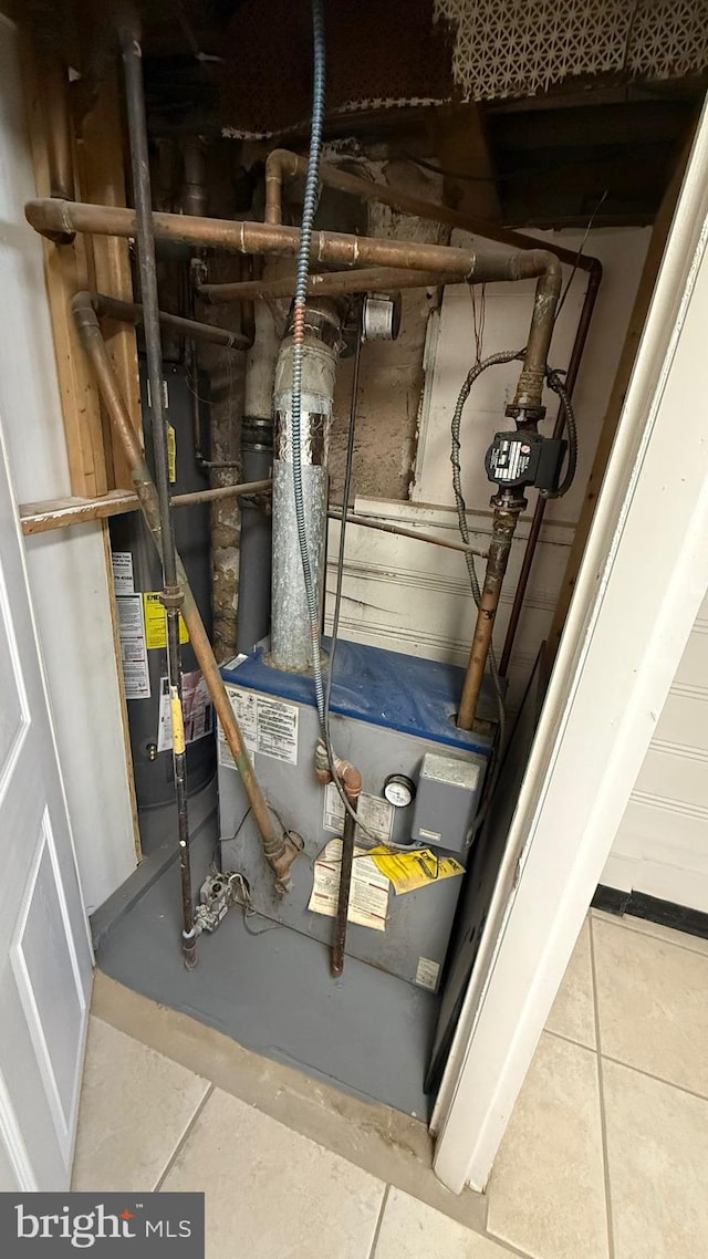 utility room with gas water heater