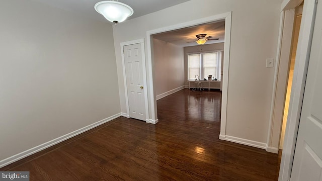 hall with dark hardwood / wood-style flooring