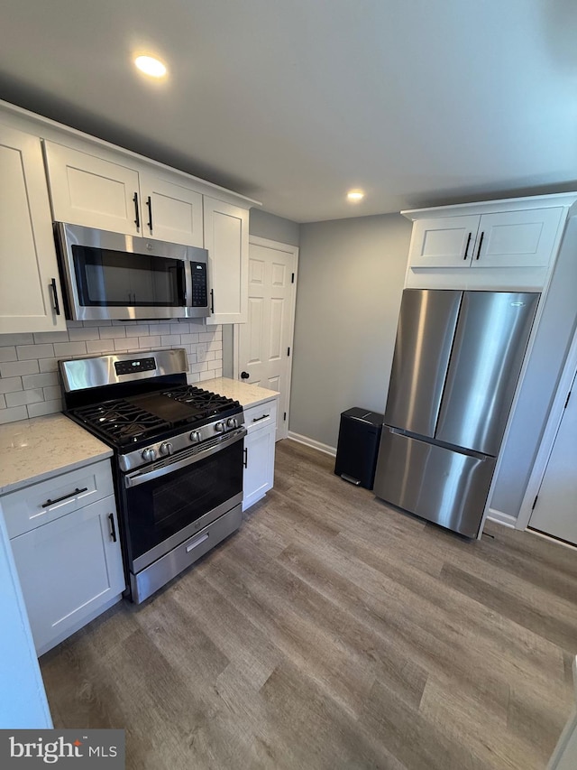 kitchen featuring white cabinetry and stainless steel appliances