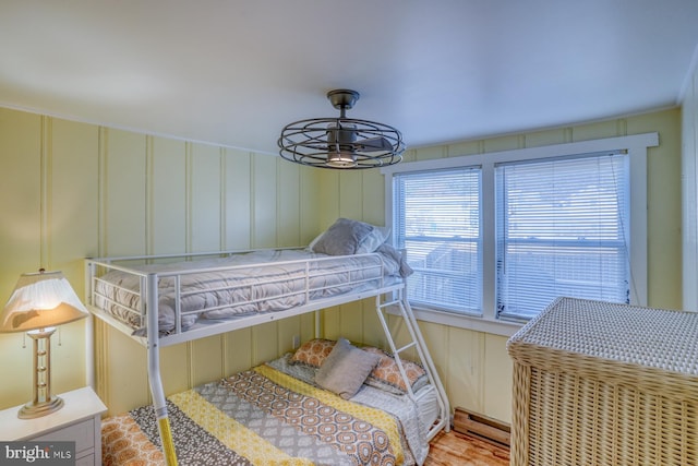 bedroom featuring light hardwood / wood-style floors and baseboard heating