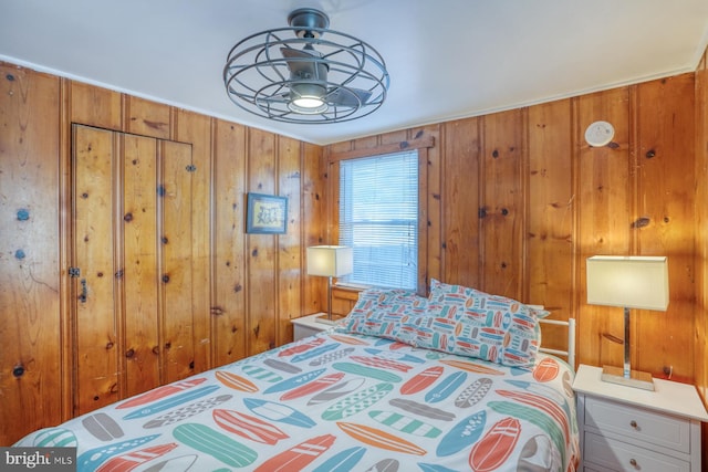 bedroom with wooden walls